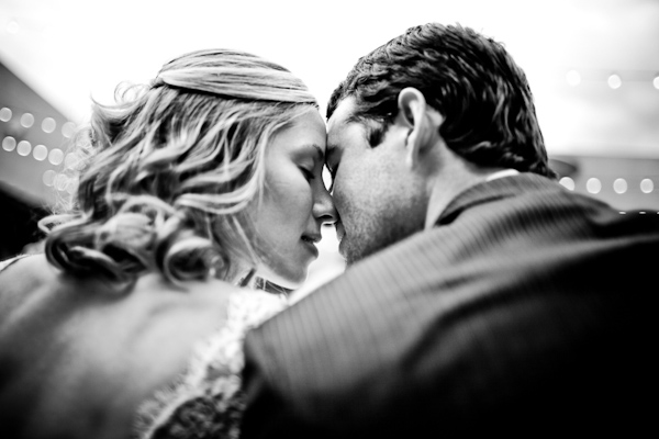 black and white photo - gorgeous intimate photo of the bride and groom nuzzling - photo by New Mexico based wedding photographers Twin Lens